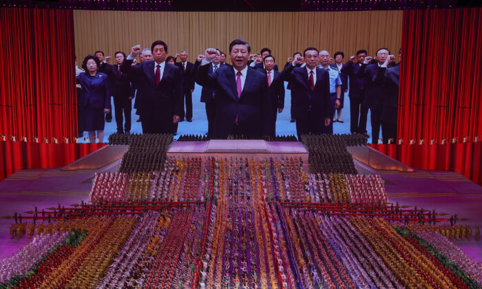 A large screen showing Chinese communist leader Xi Jinping during an art performance on June 28, 2021 in Beijing. (Lintao Zhang/Getty Images)
