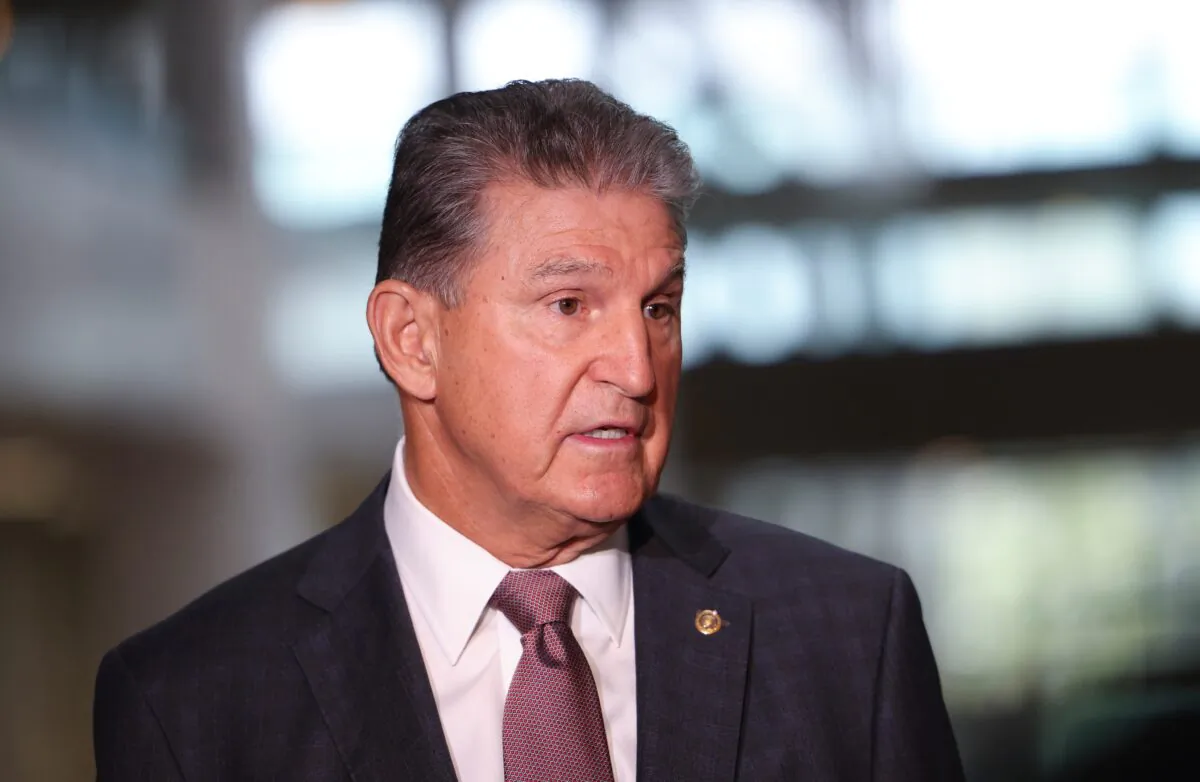 Sen. Joe Manchin (D-W.Va.) speaks to reporters outside of his office on Capitol Hill in Washington on Oct. 6, 2021. (Kevin Dietsch/Getty Images)