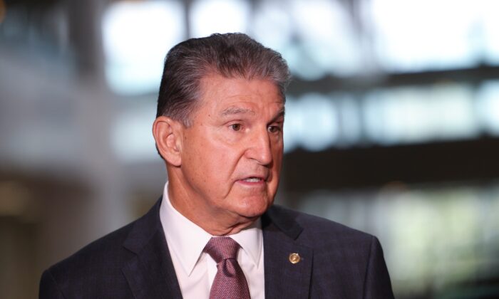 Sen. Joe Manchin (D-W.Va.) speaks to reporters outside of his office on Capitol Hill in Washington on Oct. 6, 2021. (Kevin Dietsch/Getty Images)