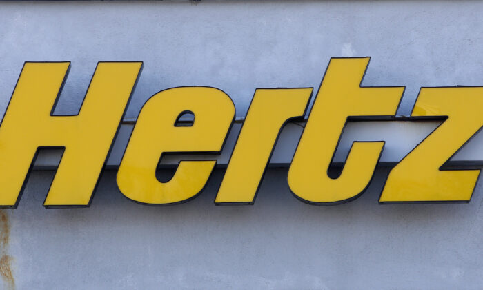 A Hertz rental car logo rests on the front of a Hertz location, in Boston on Nov. 28, 2017. (Steven Senne/AP Photo)