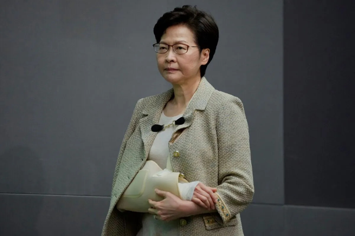 Hong Kong Chief Executive Carrie Lam wearing an arm brace after suffering fracture from fall at home, attends a press conference in Hong Kong, on Oct. 26, 2021. (Kin Cheung/AP Photo)