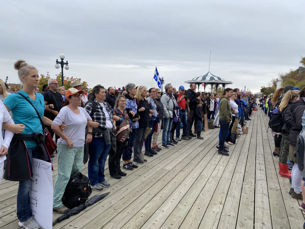 Front-line workers and first responders gather in front of Château Frontenac to protest Quebec's vaccine mandate, in Quebec City on Oct. 15, 2021. (Sonia Rouleau/The Epoch Times)