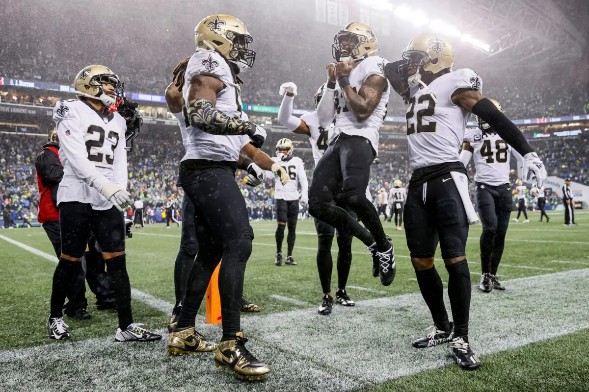 Malcolm Jenkins #27 of the New Orleans Saints celebrates with Demario Davis #56 following a defensive stop against the Seattle Seahawks at Lumen Field in Seattle, Wash., on Oct. 25, 2021. (Steph Chambers/Getty Images)