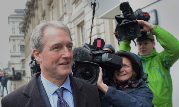 Owen Paterson with reporters after a parliamentary standards watchdog found said he had broken rules on lobbying, on Oct. 26, 2021. (Stefan Rousseau/PA)
