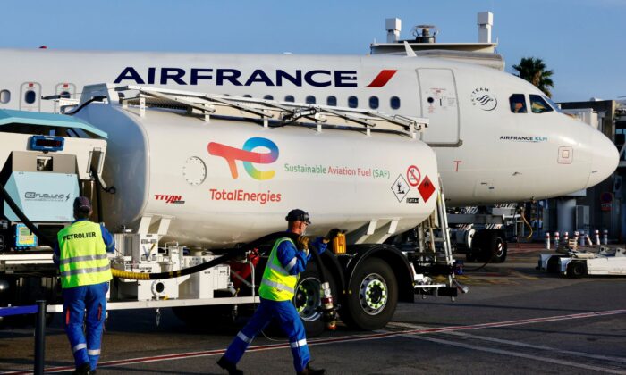 An Air France aircraft, operated with sustainable aviation substance  (SAF) produced by TotalEnergies, is refueled earlier  its archetypal  formation  from Nice to Paris astatine  Nice airport, France connected  Oct. 1, 2021. (Eric Gaillard/Reuters)