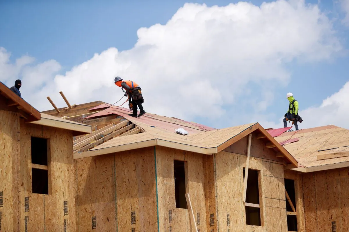 Carpenters work on building new townhomes that are still under construction, while building material supplies are in high demand, in Tampa, Fla., on May 5, 2021. (Octavio Jones/Reuters)