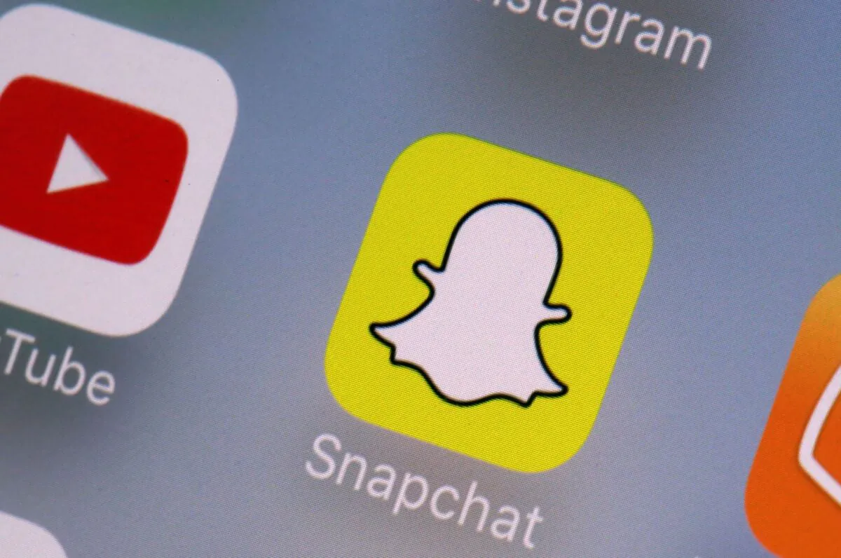 Youtube (L) and Snapchat apps on a mobile device in New York on Aug. 9, 2017. (Richard Drew/AP Photo)