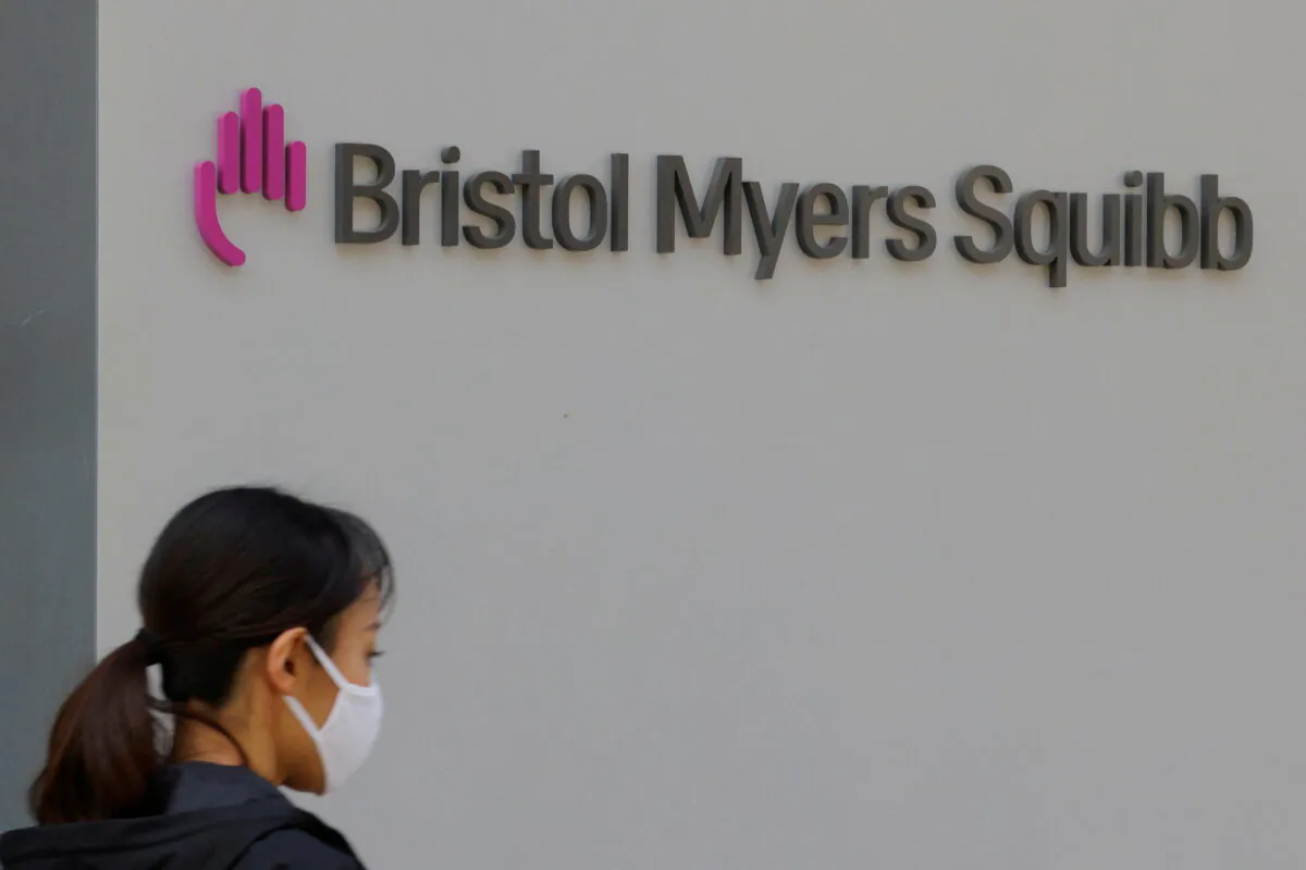 A sign stands outside a Bristol Myers Squibb facility in Cambridge, Mass., on May 20, 2021. (Brian Snyder/Reuters)