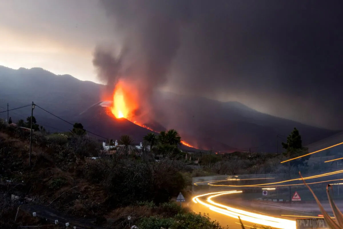 Lava flows from a volcano as it continues to erupt on the Canary island of La Palma, Spain, on Oct. 27, 2021. (Emilio Morenatti/AP Photo)