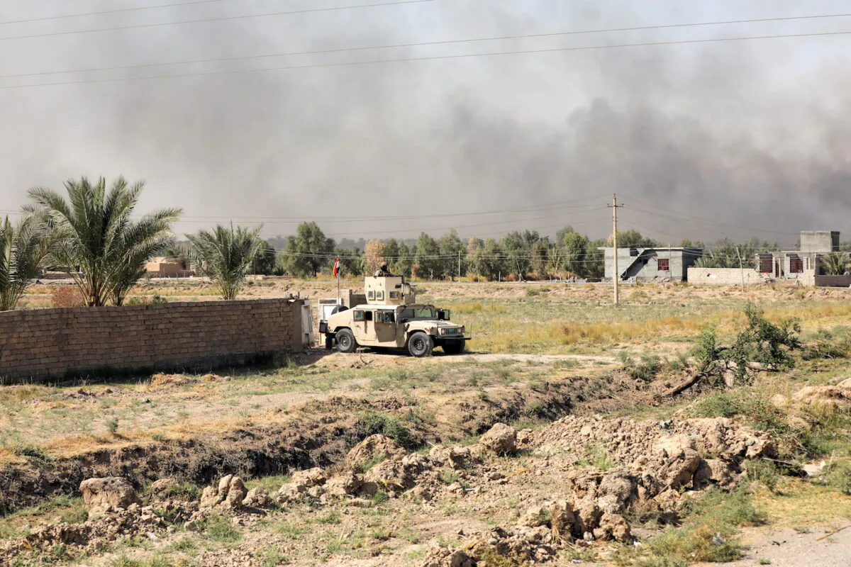 A member of Iraqi security forces is seen after an attack by ISIS terrorists near Muqdadiya, Iraq, on Oct. 27, 2021. (Stringer/Reuters)