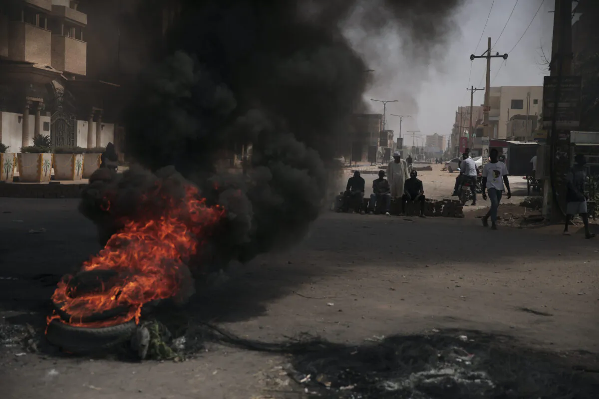 People burn tires during a protest a day after the military seized power in Khartoum, Sudan, on Oct. 26, 2021. (Marwan Ali/AP Photo)