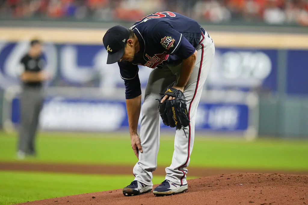 Atlanta Braves starting pitcher Charlie Morton rubs his leg before leaving the game during the third inning of Game 1 in baseball's World Series between the Houston Astros and the Atlanta Braves in Houston, on Oct. 26, 2021. (Ashley Landis/AP Photos)