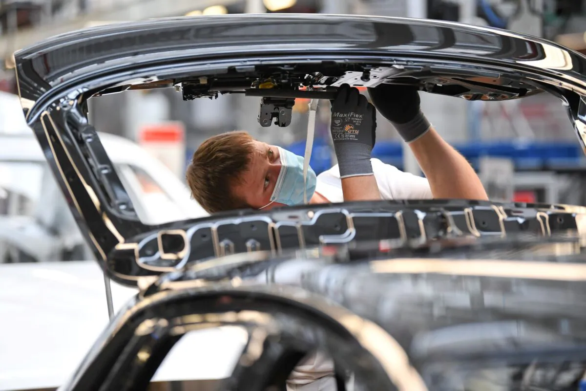 An employee works at the A3 and A4 production line of the German car manufacturer Audi, amid the spread of the coronavirus disease (COVID-19) in Ingolstadt, Germany on June 3, 2020. (Andreas Gebert/Reuters)