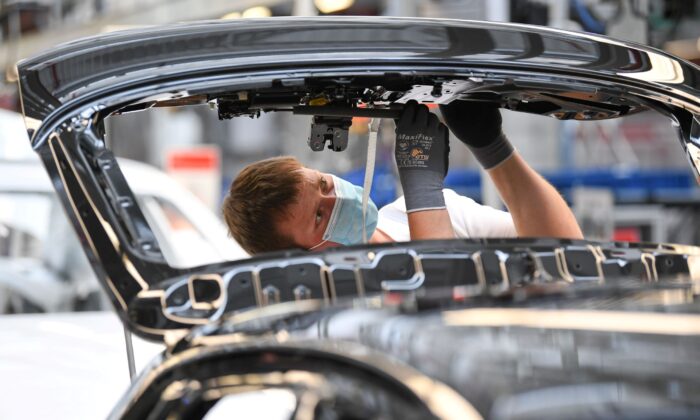 An worker  works   astatine  the A3 and A4 accumulation   enactment     of the German car   shaper   Audi, amid the dispersed  of the coronavirus illness  (COVID-19) successful  Ingolstadt, Germany connected  June 3, 2020. (Andreas Gebert/Reuters)