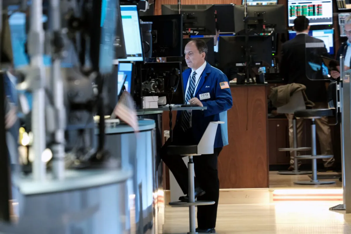 A trader works on the floor of the New York Stock Exchange (NYSE) in New York City on Oct. 25, 2021. (Spencer Platt/Getty Images)
