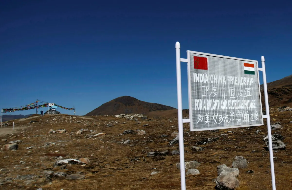 A signboard is seen from the Indian side of the Indo-China border at Bumla, in the northeastern Indian state of Arunachal Pradesh, on Nov. 11, 2009. (Adnan Abidi/Reuters)