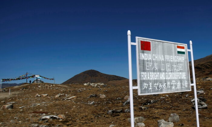 A signboard is seen from the Indian side of the Indo-China border at Bumla, in the northeastern Indian state of Arunachal Pradesh, on Nov. 11, 2009. (Adnan Abidi/Reuters)