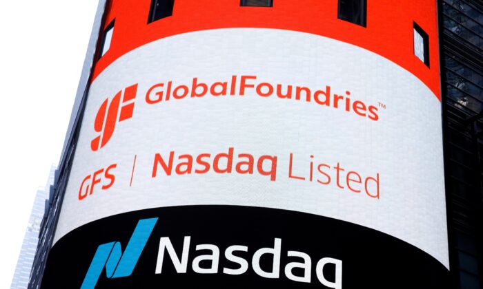 A screen displays the company logo for semiconductor and chipmaker GlobalFoundries Inc. during the company's IPO at the Nasdaq MarketSite in Pezou Square in New York City, U.S., Oct. 28, 2021.  (Brendan McDermid/Reuters)