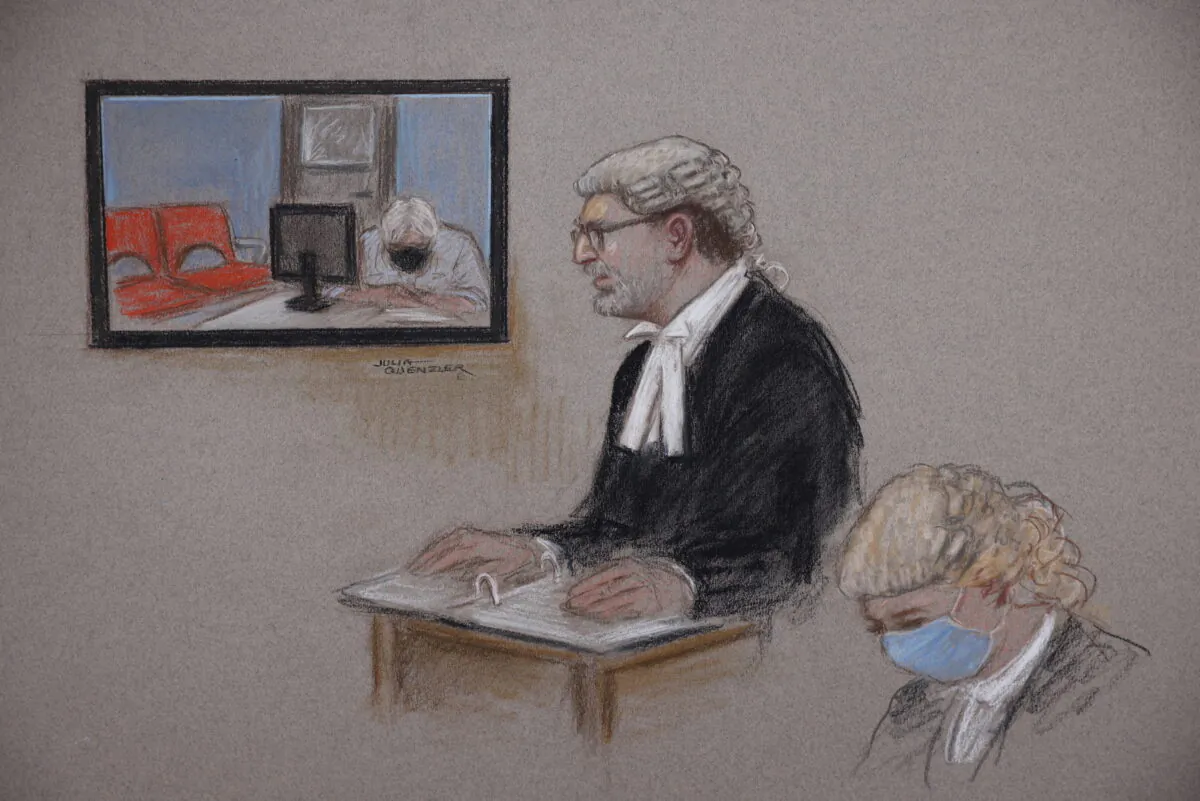 In a courtroom sketch, Wikileaks founder Julian Assange appears via video link from Belmarsh Prison for his extradition hearing in London on Oct. 27, 2021. (Julia Quenzler/Handout via Reuters)