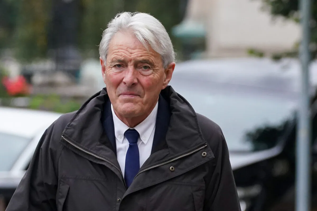 David Henderson arrives at Cardiff Crown Court, where he pleaded guilty to a charge of transporting a passenger without valid permission or authorization, relating to the plane crash death of Argentine soccer player Emiliano Sala, in Cardiff, Wales, on Oct. 18, 2021. (Jacob King/PA)