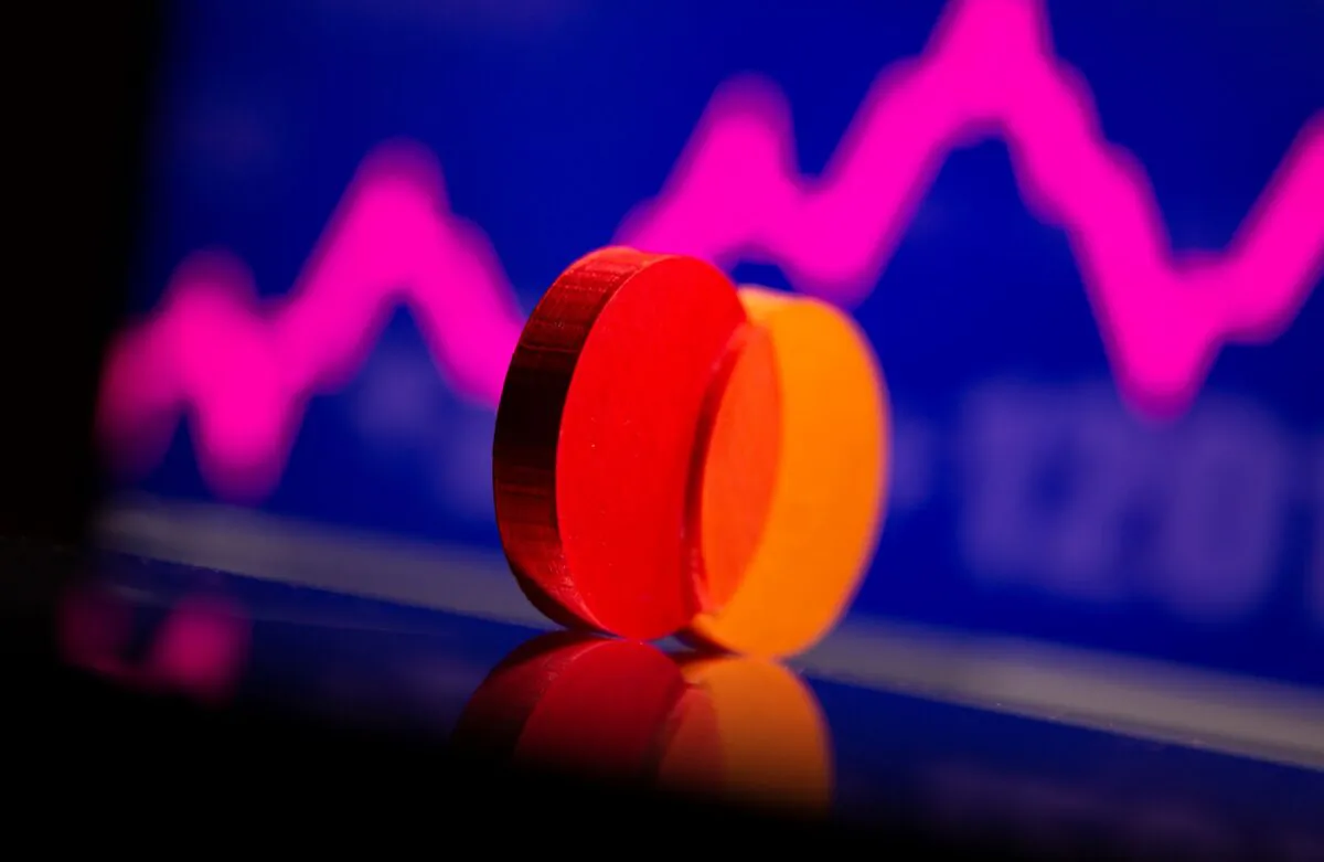 A 3D printed Mastercard logo is seen in front of displayed stock graph in this illustration taken on Sept. 20, 2021. (Dado Ruvic/Illustration/Reuters)
