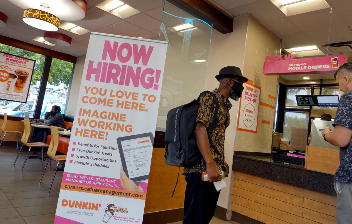 A Now Hiring sign at a Dunkin' restaurant in Hallandale, Fla., on Sept. 21, 2021. (Joe Raedle/Getty Images)