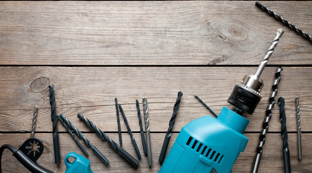 If you plan to do a lot of projects, you may also need a couple different types of drills. (Marek Mnich/Shutterstock)