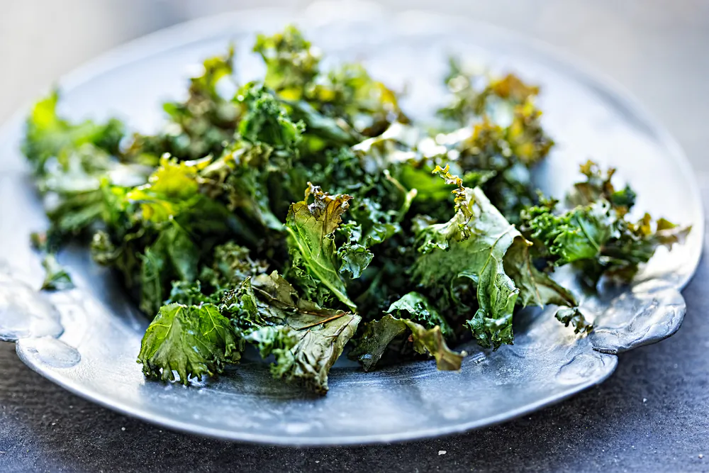 The base of this recipe is kale, salt, and oil. From there, the flavor combinations are near-infinite. (Bartosz Luczak/Shutterstock)