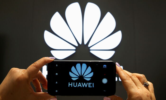 A Huawei logo is seen on a cell phone screen in their store at Vina del Mar, Chile, on July 18, 2019. (Rodrigo Garrido/Reuters)