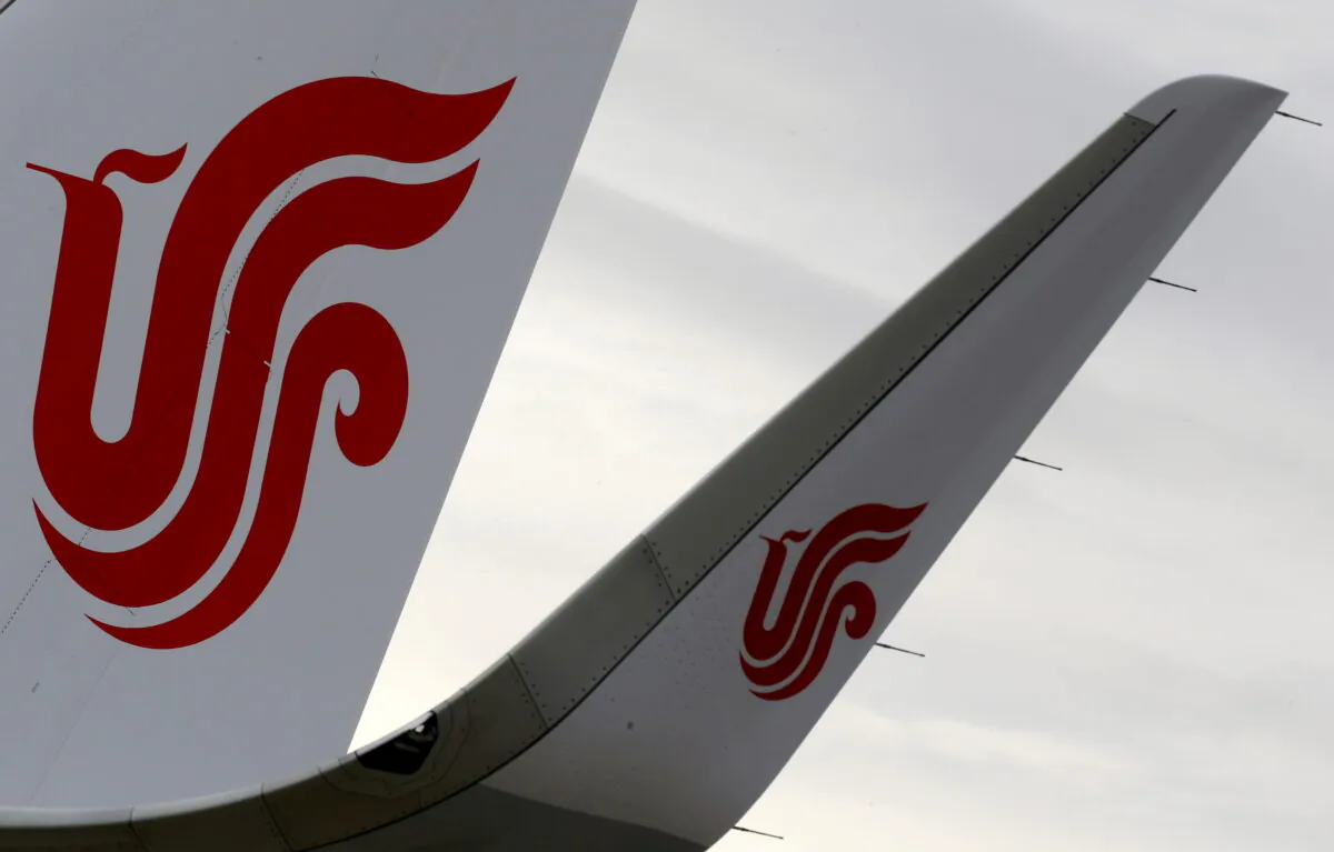 The logo of Air China is pictured on a tail of an airplane parked at the headquarters of Airbus in Colomiers near Toulouse, France, on Nov. 15, 2019. (Regis Duvignau/Reuters)