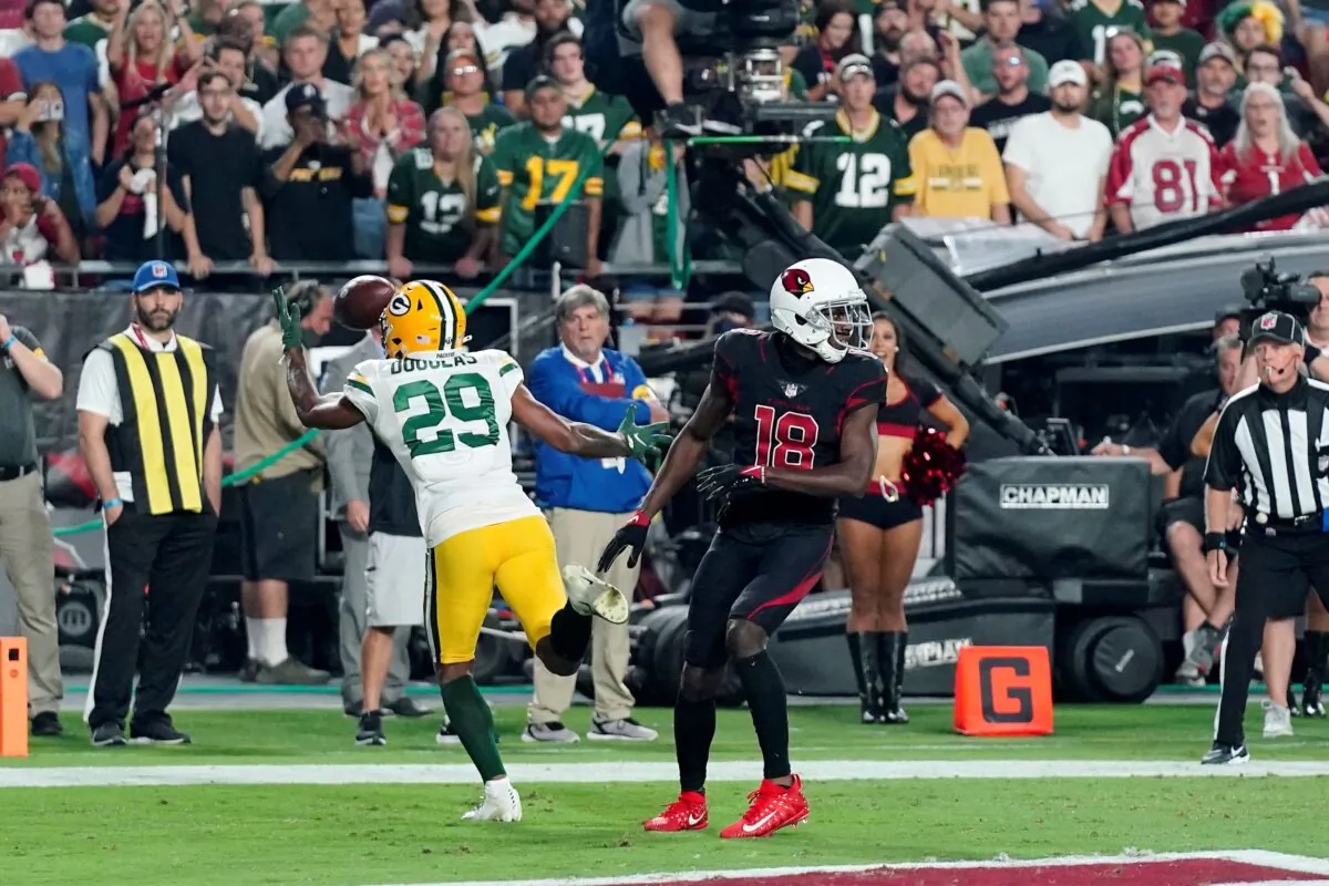 Green Bay Packers cornerback Rasul Douglas (29) intercepts a pass intended for Arizona Cardinals wide receiver A.J. Green (18) in the end zone during the second half of an NFL football game in Glendale, Ariz., on Oct. 28, 2021. (Ross D. Franklin/AP Photo)