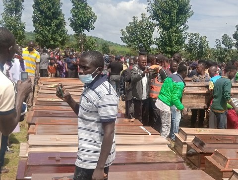 Caskets bearing the corpses of 38 Christian villagers killed in Madamai village, in central Nigeria, by armed Fulani Muslim terrorists on Sept. 26, 2021, being arranged for a funeral Mass at the Government Secondary School, Mallagun, about 2 miles from Madamai on the Sept. 30, 2021. (Luka Binniyat/The Epoch Times)