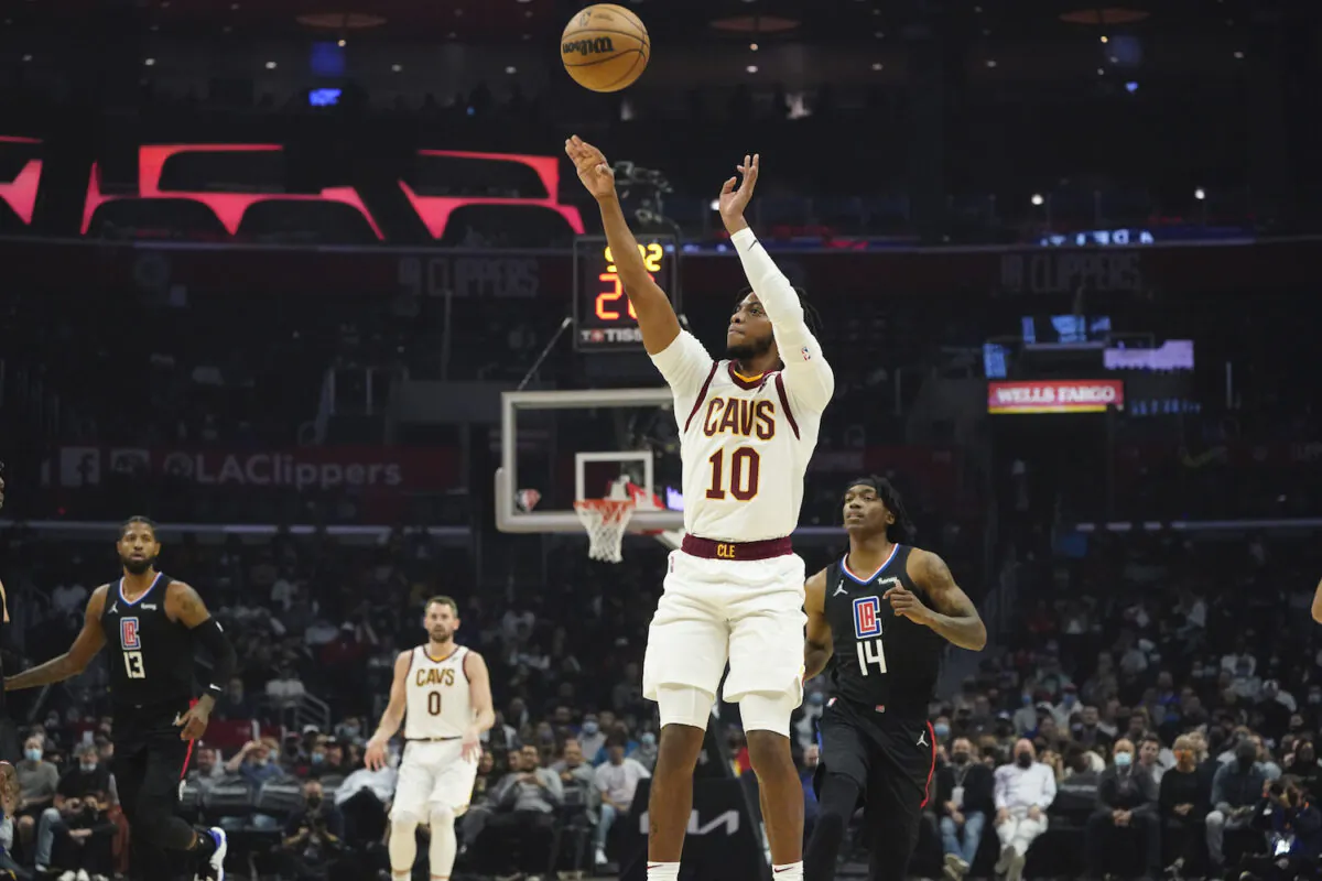 Cleveland Cavaliers guard Darius Garland (10) makes a three-point basket during the first half of an NBA basketball game against the Los Angeles Clippers in Los Angeles on Oct. 27, 2021. (AP Photo/Marcio Jose Sanchez)