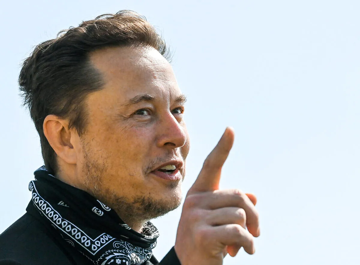 Tesla CEO Elon Musk gestures as he visits the construction site of Tesla's Gigafactory in Gruenheide near Berlin, Germany, on Aug. 13, 2021. (Patrick Pleul/Pool via Reuters)