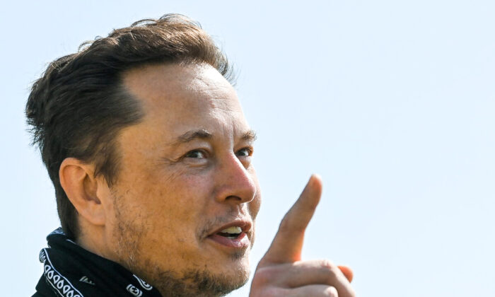 Tesla CEO Elon Musk gestures as he visits the construction site of Tesla's Gigafactory in Gruenheide near Berlin on Aug. 13, 2021. (Patrick Pleul/Pool via Reuters)