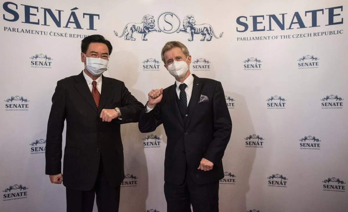President of Czech Senate Milos Vystrcil (R) bumps elbows with Taiwan's Foreign Minister Joseph Wu, in Taiwan, on Oct. 27, 2021. (Michal Cizek/AFP via Getty Images)