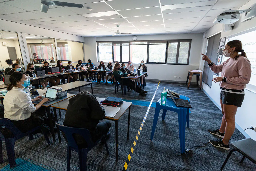 A teacher is seen wearing a mask in class in a file photo. (Daniel Pockett/Getty Images)