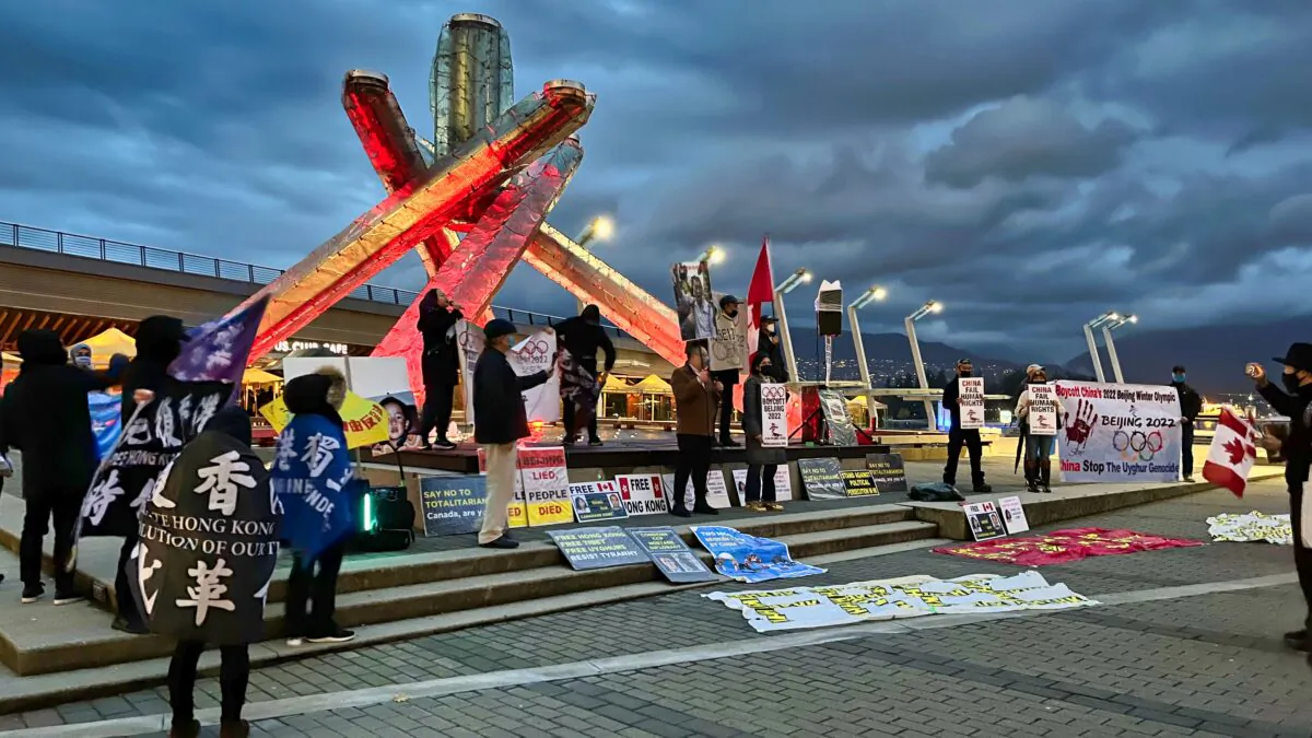 China Human Rights Watch and other groups call for a boycott of the 2022 Beijing Olympics at the Jack Poole Plaza in Vancouver on the evening of Oct. 27, 2021. (Vivian Yu/NTDTV)