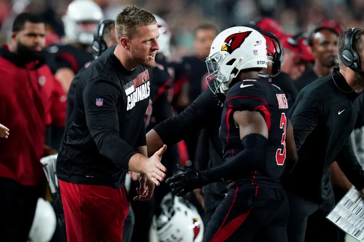 Arizona Cardinals defensive end J.J. Watt greets safety Budda Baker (3) during the first half of an NFL football game against the Green Bay Packers in Glendale, Ariz., on Oct. 28, 2021. (Ross D. Franklin/AP Photo)