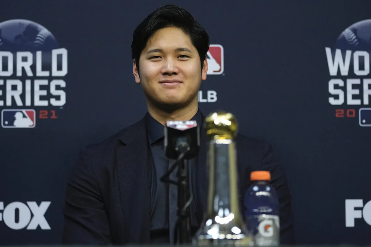 Shohei Ohtani wins the Commissioner’s Historic Achievement Award from Rob Manfred before Game 1 in baseball’s World Series between the Houston Astros and the Atlanta Braves in Houston on Oct. 26, 2021. (AP Photo/Ashley Landis)