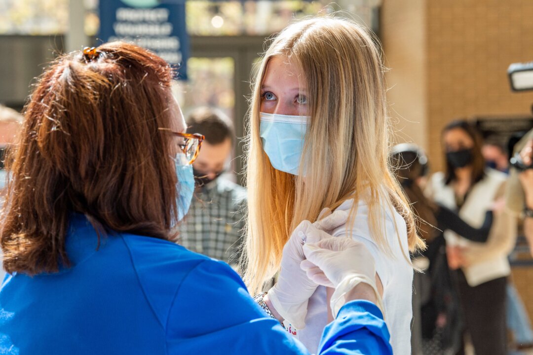 A 14-year-old girl gets a Pfizer COVID-19 vaccine in Hartford, Conn., on May 13, 2021. (Joseph Prezioso/AFP via Getty Images)