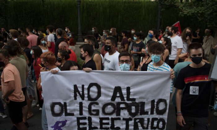 People protest during a demonstration against the increase of household electricity bills in Granada, Spain on Sept. 19, 2021. (Jorge Guerrero/AFP via Getty Images)