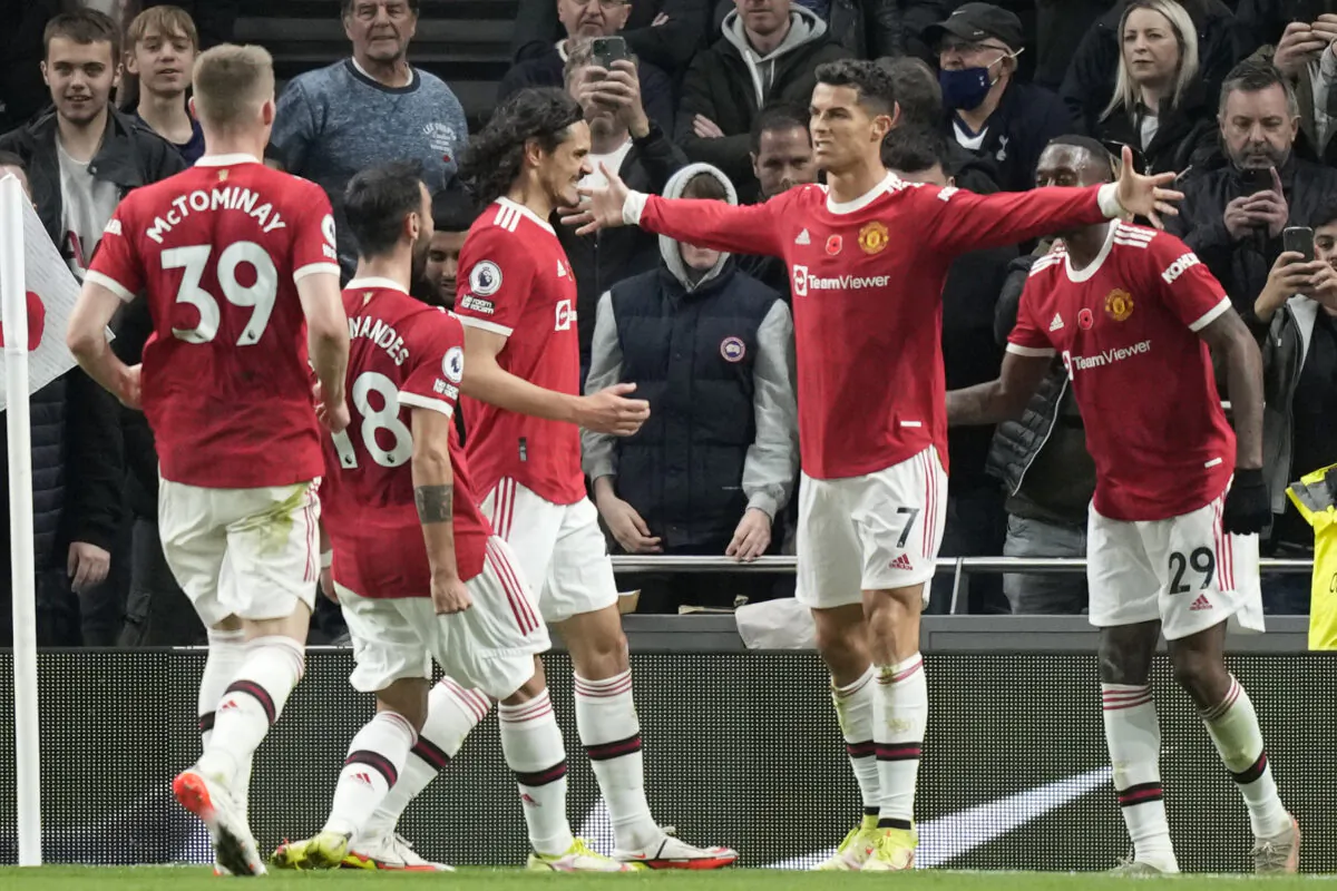 Manchester United's Cristiano Ronaldo (center R) celebrates after scoring his side's opening goal during the English Premier League soccer match between Tottenham Hotspur and Manchester United at the Tottenham Hotspur Stadium in London, England on Oct. 30, 2021. (Frank Augstein/AP Photo)