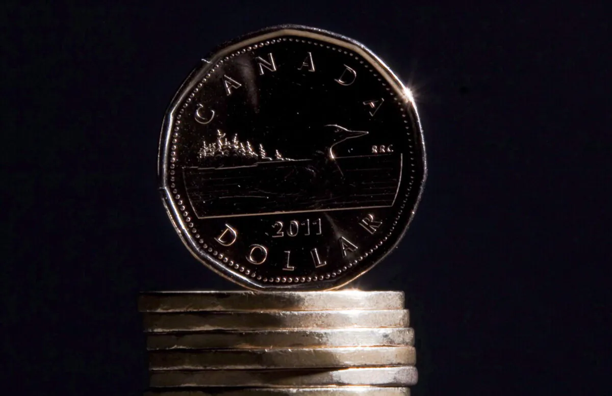 Canadian dollar coins are pictured in a file photo. (Jonathan Hayward/The Canadian Press)