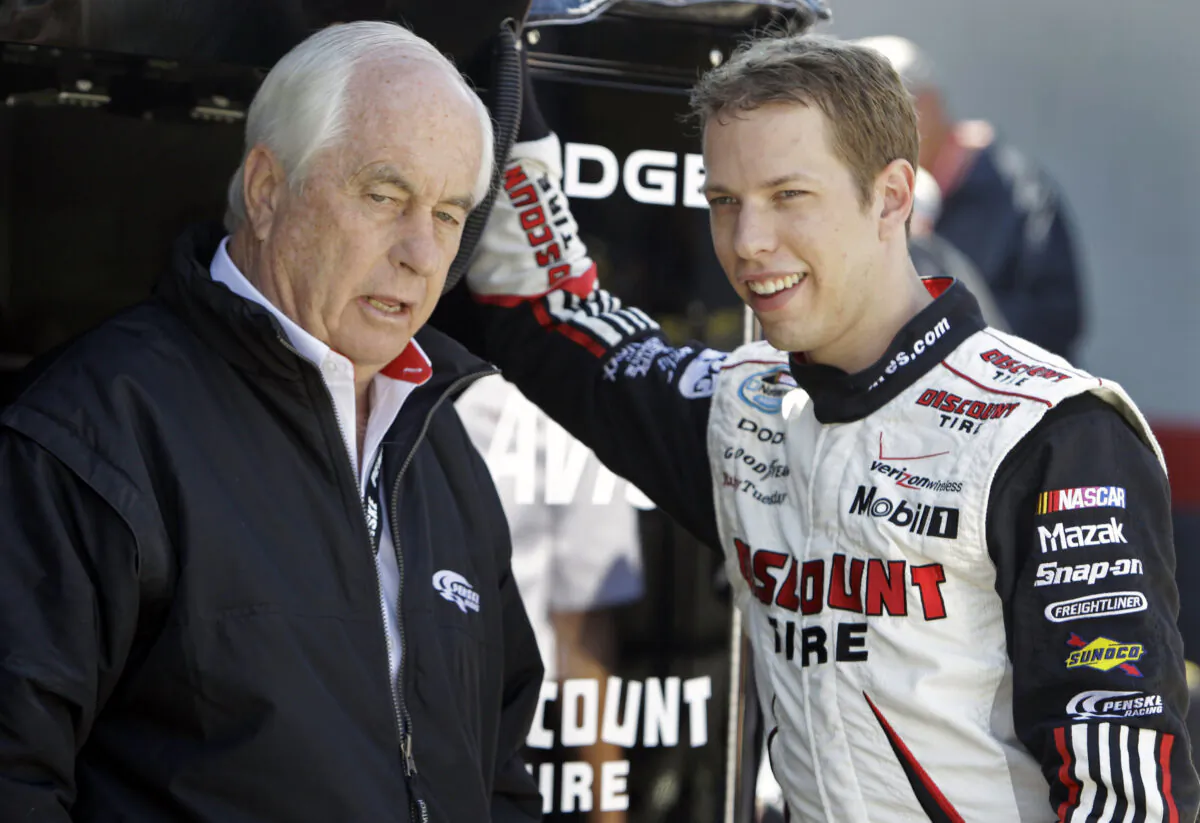 NASCAR driver Brad Keselowski (R) talks with team owner Roger Penske during practice for the NASCAR Sprint Cup series Food City 500 auto race at Bristol Motor Speedway in Bristol, Tenn., on March 20, 2010. (Chuck Burton/AP Photo)