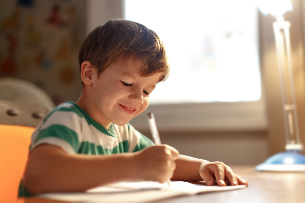 Encourage children to write often, whether it's letters to family or stories they invent. (Sakkmesterke/Shutterstock)