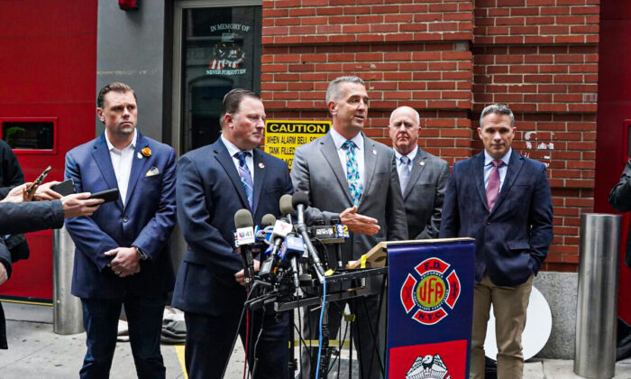 Firefighter Union leaders speak to reporters in Manhattan, New York, on Oct. 29, 2021. (Enrico Trigoso/The Epoch Times)