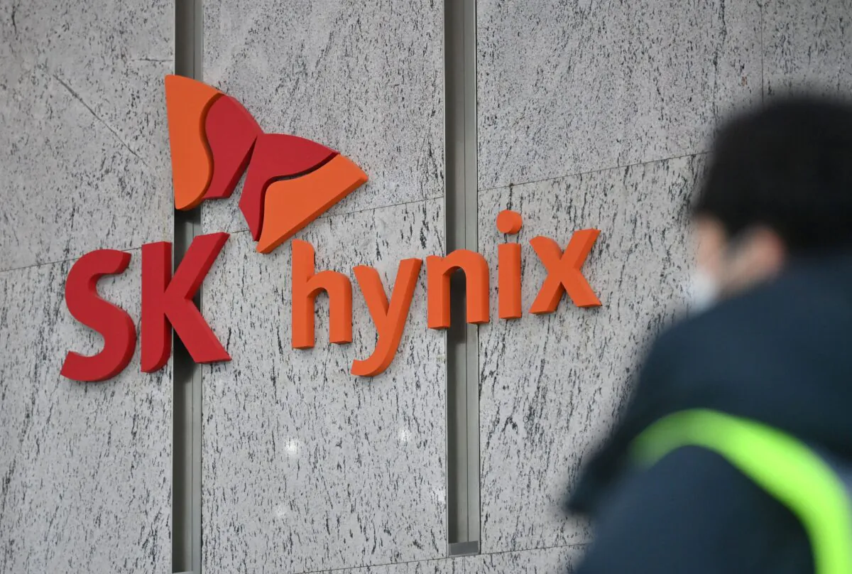 A man walks past a logo of SK Hynix at the lobby of the company's Bundang office in Seongnam on Jan. 29, 2021. (Jung Yeon-je/AFP via Getty Images)