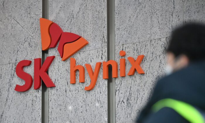 A man walks past a logo of SK Hynix at the lobby of the company's Bundang office in Seongnam on Jan. 29, 2021. (Jung Yeon-je/AFP via Getty Images)