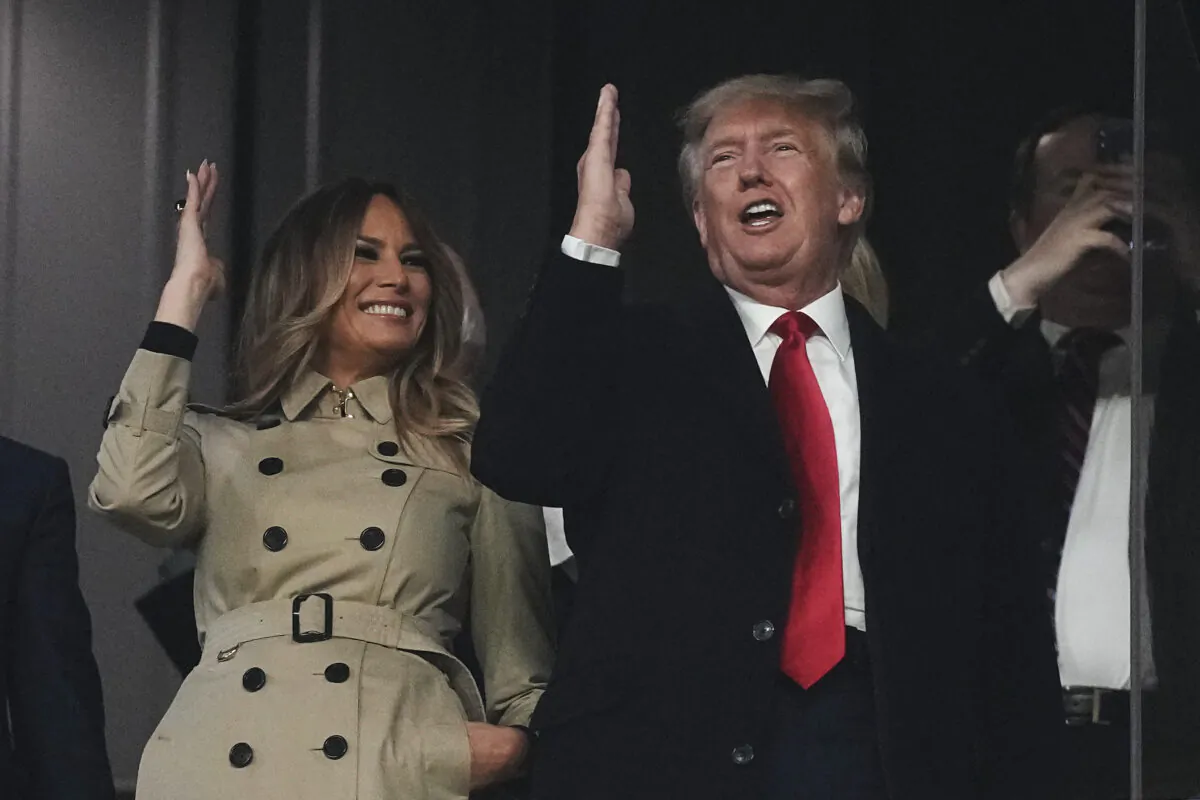 Former President Donald Trump and his wife Melania perform the tomahawk chop before Game 4 of baseball's World Series between the Houston Astros and the Atlanta Braves, in Atlanta, Ga., on Oct. 30, 2021. (David J. Phillip/AP Photo)